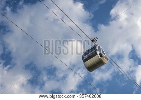 Cable Car Against Blue Sky With White Clouds. Cable Car Connects Sparrow Hills (well Known As Voroby