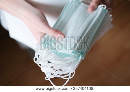 Human Hand Holding Medical Face Masks. Coronavirus Or Covid -19 Prevention. Clobal Pandemic. Virus S