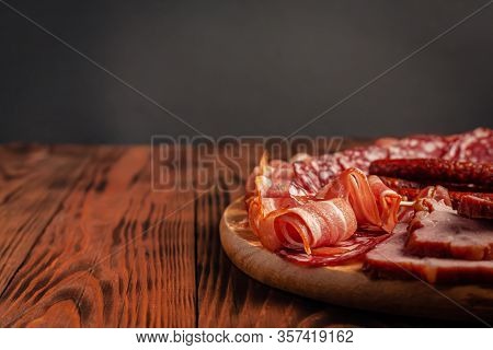 Assorted Meat Snacks On A Wooden Cutting Board. Sausage, Ham, Bacon, Smoked Meats. Stock Photo Of Me
