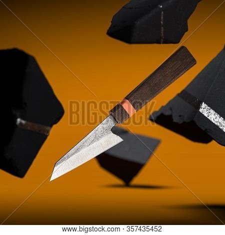 Brand New Damascus Steel Japanese Kitchen Knife With Clipping Path On Yellow Background Near Stones.