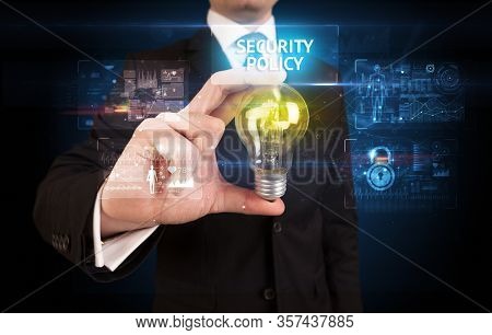 Businessman holding lightbulb with SECURITY POLICY inscription, online security idea concept