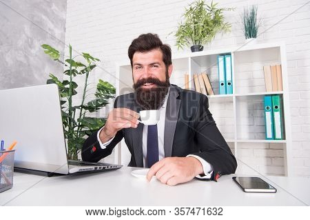 Reception Room. Respectable Ceo. Man Handsome Boss Sit In Office Drinking Coffee. Comfy Workspace. B