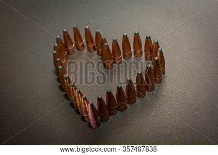 Unloaded Bullets Standing Up Shaped Into A Heart Showing Peace Not War