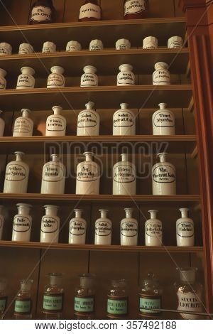 Enkhuizen, The Netherlands - October 12th 2018: Vintage Glass Bottles In A Reconstructed 19th Centur