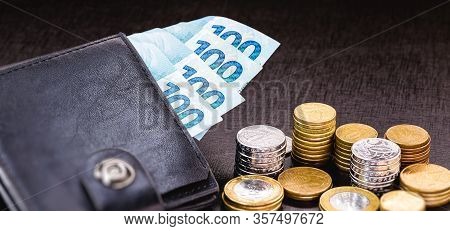 Wallet Full Of Money From Brazil, One Thousand Reais On One Hundred Reais Bank Notes. With Coins In