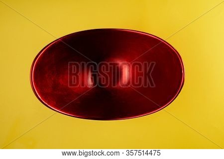 red oval shape oriental container on yeollow background