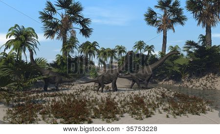 drie brachiosaurus op de wal