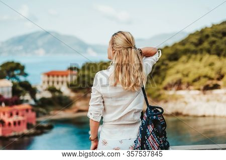 Tourist Female In Greek Small Vivid Colored Assos Village In Morning. Kefalonia, Greece. Sommer Vaca