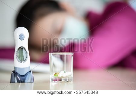 Blur Photo Of Female Employee Wearing Hygiene Protective Mask Working In Office And Feel Sick Fever 