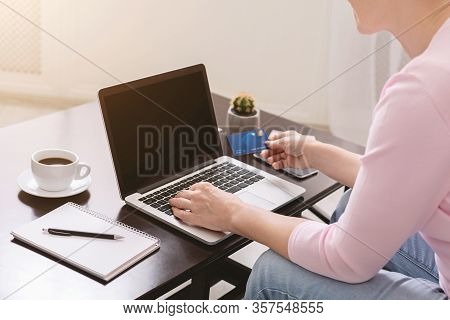 Stay At Home And Shopping Online. Senior Woman Buying Goods In Internet At Home, Close Up