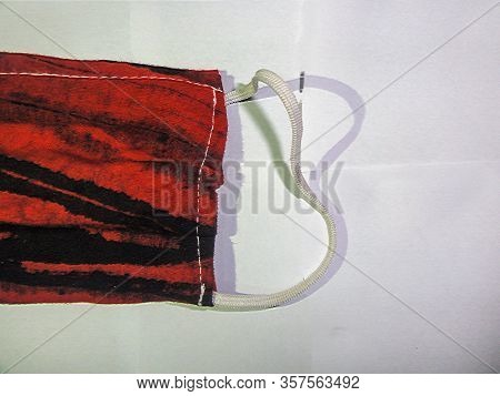 A Mask Of Cloths On The White Background