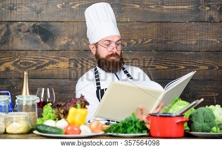 Checking Shopping List. Vitamin. Man Use Kitchenware. Dieting With Organic Food. Fresh Vegetables. C