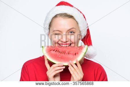Christmas Summer Destinations. Christmas Girl Eat Watermelon. Woman Santa Hat Hold Slice Watermelon.
