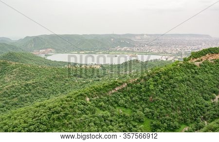 Landscape Of Man Sagar Lake With Jal Mahal, Hanuman Temple And Govind Devji Near Jaipur, India