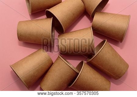 Craft Paper Cups For Coffee Or Any Drinks On A Pink Paper Background. Concept Of Ziro Waste, No Plas