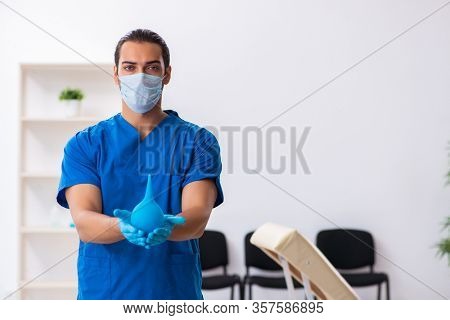 Young male doctor working in the clinic