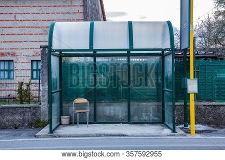 Manzano, Italy - 25.03.2020: Little Italian City During An Epidemic. Empty Bus Stop. Deserted Street