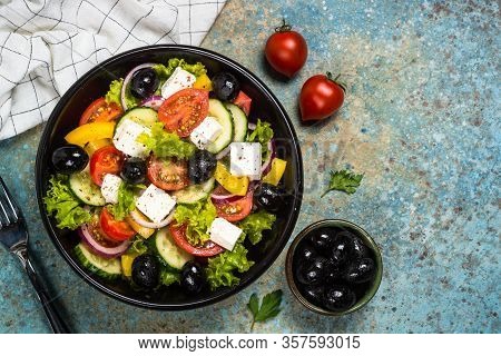 Greek Salad. Vegetable Salad From Tomato, Cucumber, Feta Cheese And Olive Oil. Mediterranean Kitchen