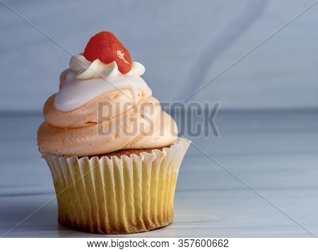 Vanilla Cupcake With Orange And White Swirled Frosting And An Orange Candy Gumdrop On Top, Festive A