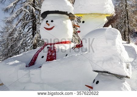 Three Nice, Decorative Snowmens With Heads In A Skii Area