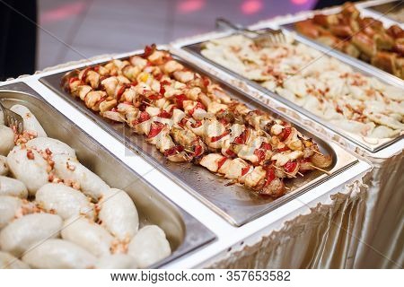 Potato Dumpling With Meat. Polish Wedding Catering Table. Chicken Shashlik With Vegetables. Typical 