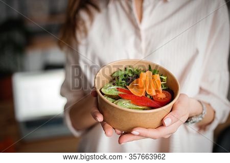 Woman Holds A Paper Plate With Food. Home Delivery Food. Healthy Eating Concept. When You Stay At Ho