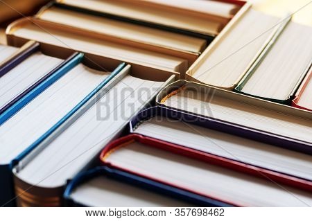 Background Of Hardbound Books Arranged In Stacks In Bookstore, Selective Focus