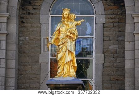 Montreal, Canada - October 27, 2019 - The Gold Statue Of Virgin Mary And Baby Jesus At Notre-dame De