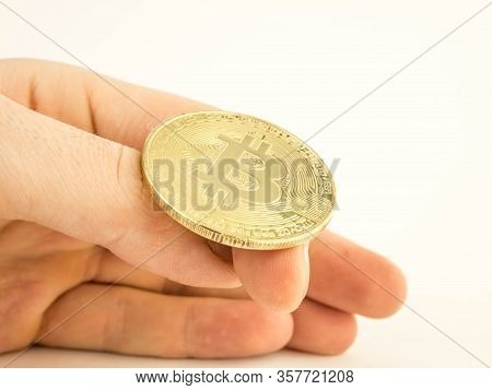 A Mans Hand Is Going To Flip A Gold Coin Bitcoin