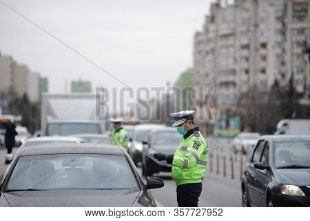 Romanian Road Police Officer Pulls Over A Car To Check For The Driver’s Identity Papers.