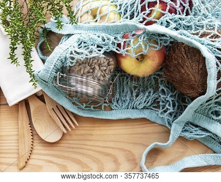 Net Bag With Reusable  Glass Jars, Fruits And Bamboo Cutlery. Zero Waste Concept. Eco Friendly. Flat