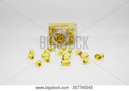 Fish Oil Softgel Golden Capsules Isolated On White Background