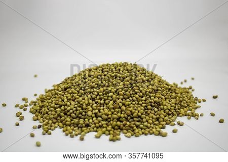Raw Coriander Seeds Isolated On White Background