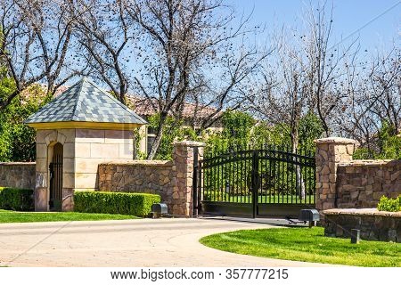Electric Entry Gate, Gate House And Flagstone Wall