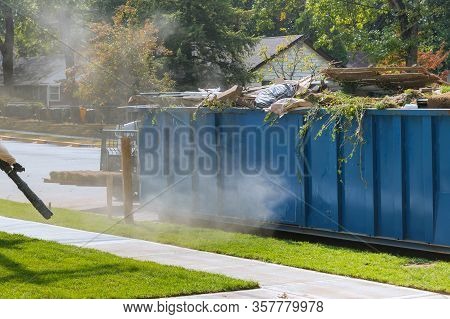Lawn Grass In Rolls On Pallets Against Of The Street The Rolled Grass Lawn Ready For Laying And Load