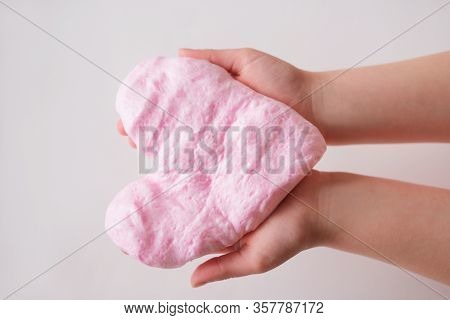 Pink Slime Or Handgum Toy In Kids Hands. Fluffy Slime In Heart Shape Diy Project. Leisure And Home M