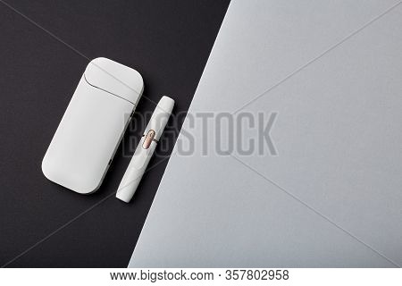 Electronic Cigarette Technology. Tobacco Iqos System. Close-up An Electric Hybrid Cigarette With A H