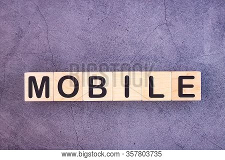 Mobile Word Made With Wood Building Blocks.