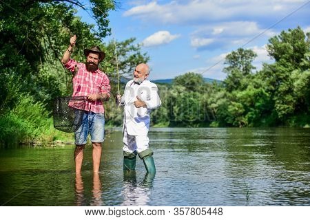 Weekend With Family. Happy Fishermen Friendship. Fly Fish Hobby Of Businessman. Retirement Fishery. 