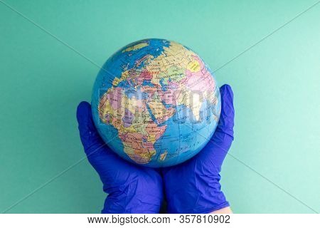 World Corona Virus Attack Concept. World Earth Put Mask To Fight Against Corona Virus. Concept Of Fi