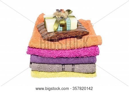 Soap And Dish On Top Of Facecloths Of Various Shades