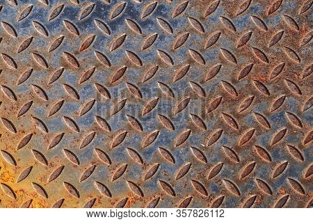 Background Of Rusty Metal Material Texture With A Pattern, Used. Distressed Enamel Metal Surface. We