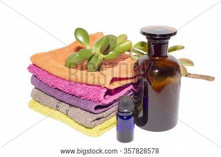 Soap On Top Of Facecloths Of Various Shades With Bottles