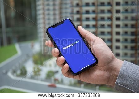 Alanya, Turkey - March 23, 2020: Man Hand Holding Iphone 11 With Application Booking.com Online Hote
