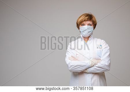 Professional Doctor In Robe And Mask. Stock Photo Portrait