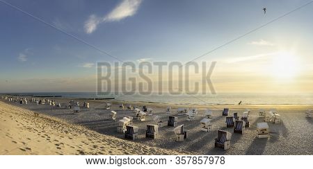 Summer Beach Landscape With Wicker Chairs At The North Sea, At Sunset. Sylt Island Beach Resort, Ger