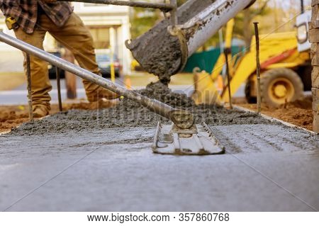 Worker Working For Concrete Pavement For Ground At Construction