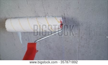Paint The Bare Wall With A Paint Roller. Hand Painted By Roller. Primer Wall Roller