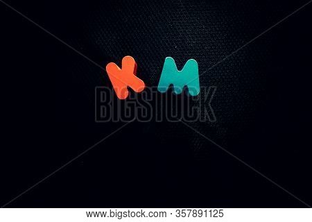 Colorful Kilometer Metric Labels On Black Background