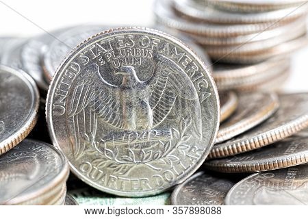 A Stack Of American Twenty-five-cent Coins, A Close-up Of American Coins